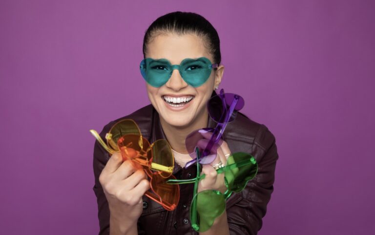 Woman holding glasses, eyewear.
